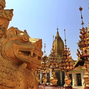 Guardian statue and ornate decorations of Shwezigon Pagoda under bright skies in Nyaung-U Guardian statue and ornate decorations of Shwezigon Pagoda under bright skies in Nyaung-U