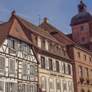 Half-timbered houses next to a large