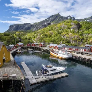 Harbour with fishing boat, Rorbu cabins Harbour with fishing boat, Rorbu cabins