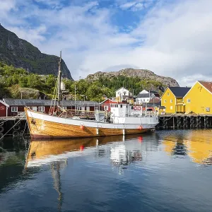 Harbour with fishing boat, Rorbu cabins Harbour with fishing boat, Rorbu cabins