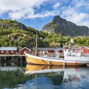 Harbour with fishing boat, Rorbu cabins Harbour with fishing boat, Rorbu cabins