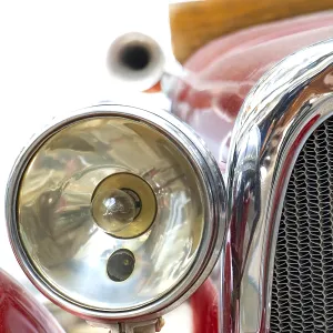The headlight of the old car. Veteran car with large chrome light The headlight of the old car. Veteran car with large chrome light