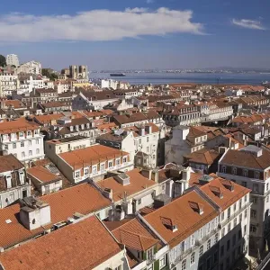 High angle view of buildings with traditional terracotta tiled rooftops in old Lisbon from Santa Justa elevator