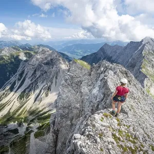 Hikers at the summit of the Lamsenspitze Hikers at the summit of the Lamsenspitze