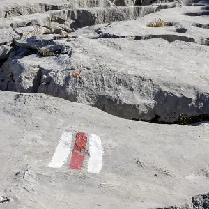 Hiking trail marking, trail sign on limestone