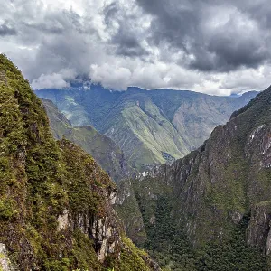 Hilly mountain landscape under cloudy sky