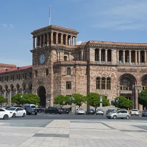 Historic building with clock tower and arches