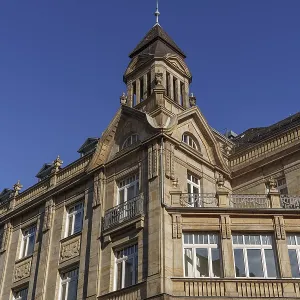 Historic building with fine sandstone architecture under blue sky Historic building with fine sandstone architecture under blue sky