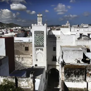 Historic city view of Tetouan with white buildings and minaret