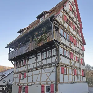 Historic half-timbered house Hoher Will built in 1697 with red shutters Historic half-timbered house Hoher Will built in 1697 with red shutters