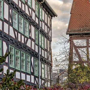 Historic half-timbered houses with red tiled roofs in autumn Historic half-timbered houses with red tiled roofs in autumn