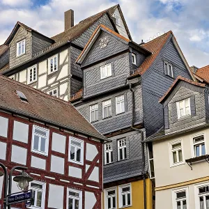 Historic half-timbered houses under a slightly cloudy sky Historic half-timbered houses under a slightly cloudy sky