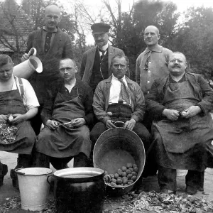 Historic photo, men peeling potatoes, ca. 1915 Historic photo, men peeling potatoes, ca. 1915