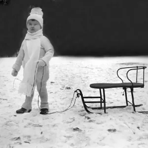 Historic photograph, child with sled, around 1918
