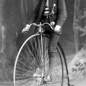 Historic photograph, man riding a penny-farthing