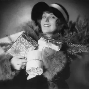 Historic photograph, woman with Christmas presents Historic photograph, woman with Christmas presents