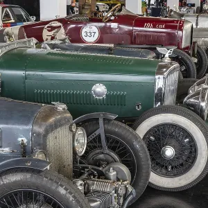 Historic racing cars lined up in a car park Historic racing cars lined up in a car park