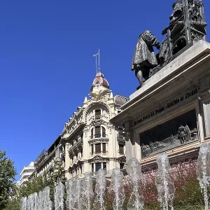 Historic square with water fountains and monument in the city center
