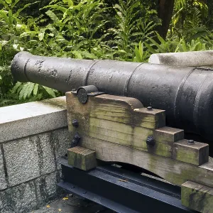 Historical 9-pounds cannon placed on the hill of famous Fort Canning Park in Singapore
