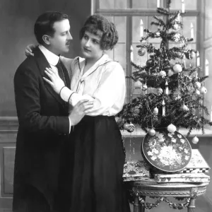 Historical photo, couple with Christmas tree Historical photo, couple with Christmas tree
