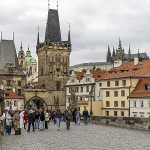 The historically significant Gothic-style Charles Bridge across the Vltava with Baroque sculpture groups