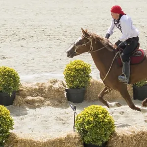 Horseman archer riding in their ethnic clothes on horseback Horseman archer riding in their ethnic clothes on horseback