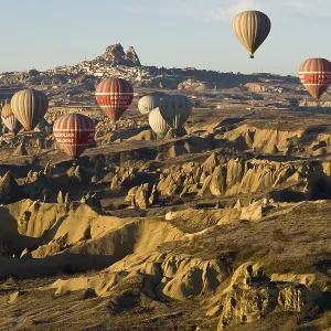 Hot air balloons in front of the Castle of Uchisar Hot air balloons in front of the Castle of Uchisar