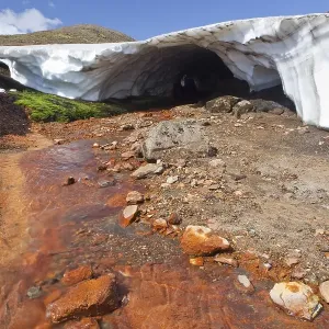 Hot red stream in a volcanic landscape Hot red stream in a volcanic landscape