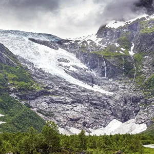 Huge glacier slides down the pass into the valley Huge glacier slides down the pass into the valley