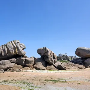 A huge granite rock formed by erosion in pink to grey-brown tones A huge granite rock formed by erosion in pink to grey-brown tones