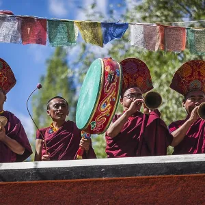HUNDER, INDIA, SEPTEMBER 6, 2011: Tibetan Buddhist monks playing traditional musical instruments HUNDER, INDIA, SEPTEMBER 6, 2011: Tibetan Buddhist monks playing traditional musical instruments