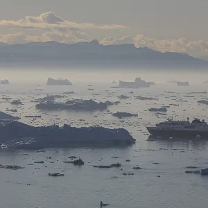 Hurtigruten ship sails through icebergs and ice floes