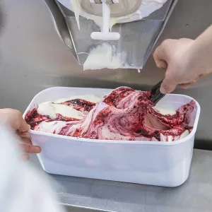 Ice cream is scraped out of a machine