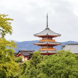 The iconic Kiyomizu-dera temple and mountain view on a sunny spring day in Kyoto