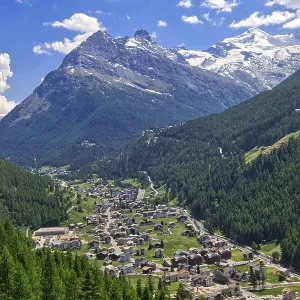 An idyllic Alpine village nestled in a green valley