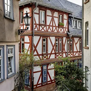 Idyllic half-timbered houses in a narrow alley with a nostalgic atmosphere Idyllic half-timbered houses in a narrow alley with a nostalgic atmosphere