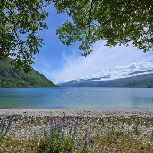 Idyllic seascape with mountains and cloudy sky