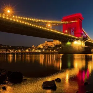 Illuminated chain bridge over the Danube at Blue Hour