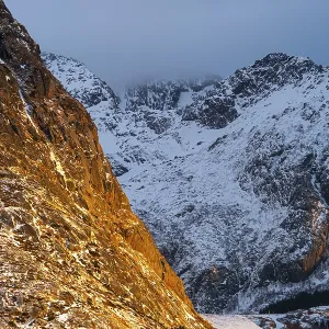Illuminated rock masiv at sunrise in Scandinavian landscape Illuminated rock masiv at sunrise in Scandinavian landscape