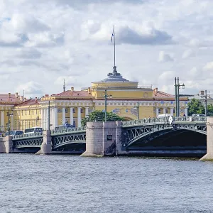 Impressive bridge over a river with historic buildings in the background