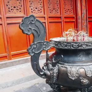 Incense and traditional building at Den ngoc son temple in Hanoi Incense and traditional building at Den ngoc son temple in Hanoi