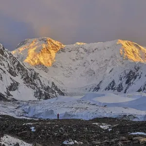 Inylcheck glacier in Kyrgyzstan with Pik Pobeda peak lit by early morning sun