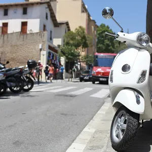 Italian vintage scooter Vespa in street Italian vintage scooter Vespa in street