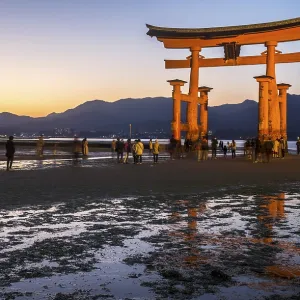 Itsukushima Shrine, Torii Gate at low tide at sunset Itsukushima Shrine, Torii Gate at low tide at sunset