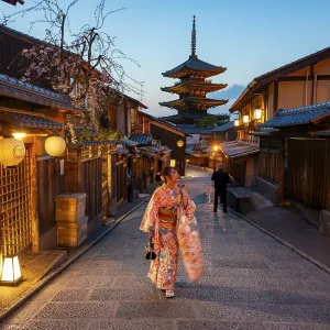 Japanese woman in kimono in an alley Japanese woman in kimono in an alley