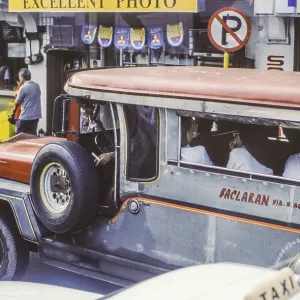 Jeepney, minibus in heavy traffic with nuns as passengers