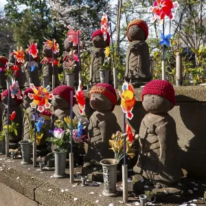 Jizo statues with red crocheted caps