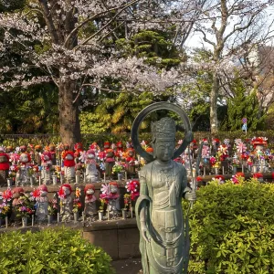 Jizo statues with red crocheted caps