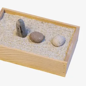 Karesansui, mini zen rocks gar den wih sand and rake Karesansui, mini zen rocks gar den wih sand and rake