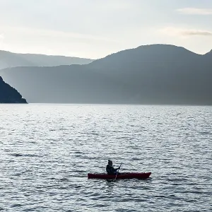 Kayaker in Eidfjord, Eidfjord village Kayaker in Eidfjord, Eidfjord village